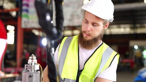 Industrial engineers working inside automation and robotics factory - New industry tech