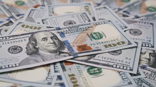 Pile of crisp one hundred dollar bills