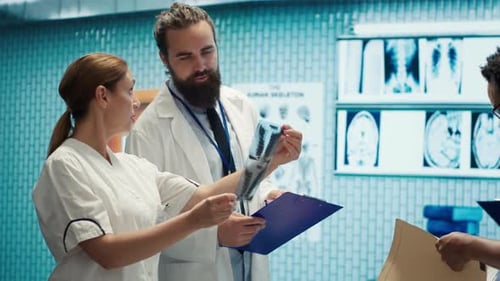 Medical Professionals Reviewing X-Rays and Patient Records