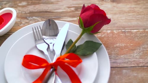 Valentines Day and Romantic Dinner Concept - Close Up of Red Rose