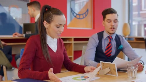 Young Professionals Discussing Business at Modern Office