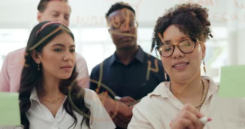Workshop, brainstorming and business people writing on glass for planning