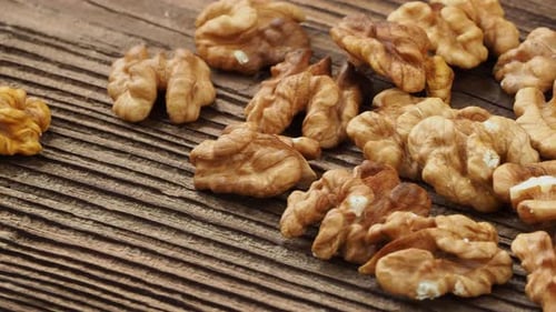 Close-Up of Shelled Walnuts on Wooden Surface