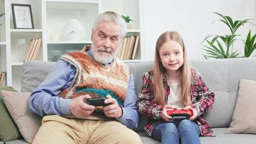 Grandfather and Grandchild Play Video Games