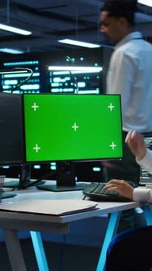 Vertical Video Technician Using Mockup Computer in Data Center