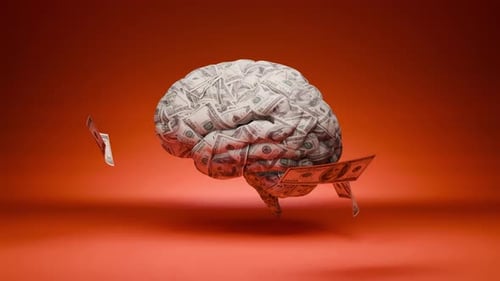 Human brain covered in dollar bills