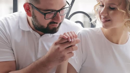 Romantic Couple Holding Hands, Man Kisses Woman's Hand