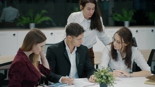 Colleagues at the Negotiating Table Business People Work Together in the Office