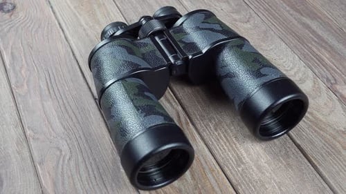 Camouflage Binoculars on a Wooden Surface