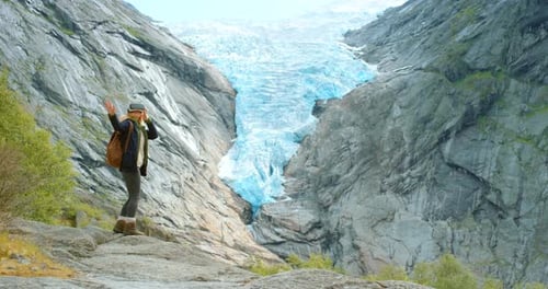 Woman Using VR Headset by a Glacier
