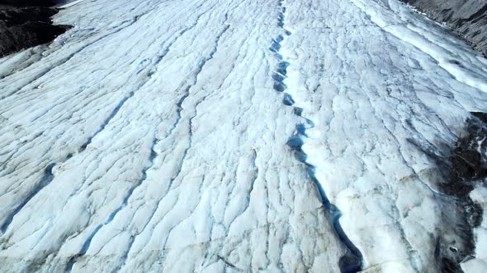 Athabasca glacier showing deep crevasses and meltwater in the canadian ...