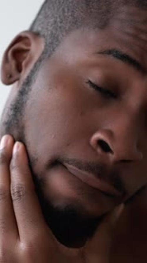 Close-Up Portrait of Handsome Shirtless Man Indoors