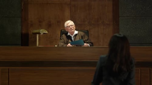 Judge Presides Over Courtroom with Lawyer