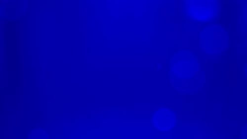 A blue background with a blurry circle in the middle