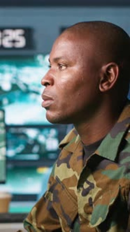 Vertical Video Intelligence Operative in Military Base Doing Surveillance with Radar