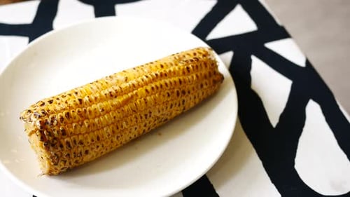 Delicious Grilled Corn on Plate Close Up