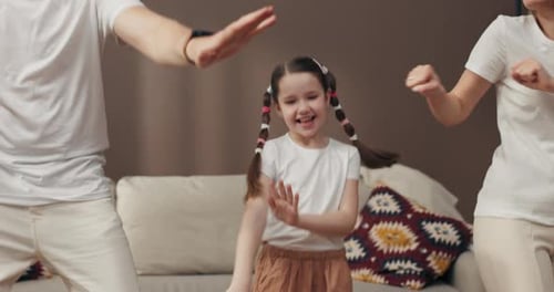 Cheerful Family Dancing Together at Home