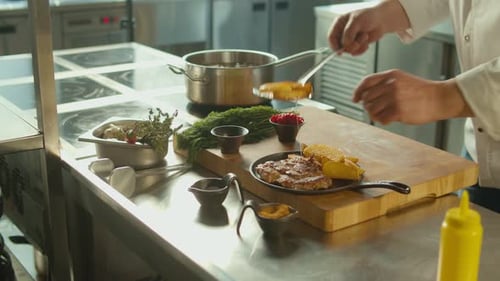 Chef Plates Steak and Potatoes in Restaurant Kitchen