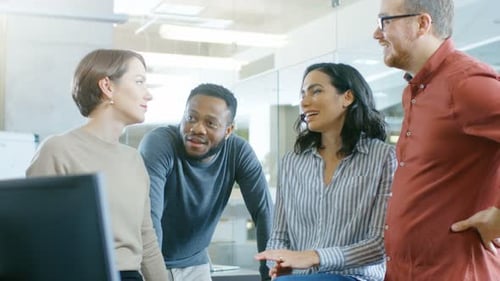 Smiling Colleagues Chatting in Bright Modern Office