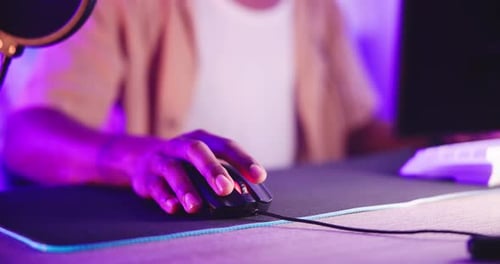 Mouse, hands and man gamer in house with online competition, challenge or intense esports contest