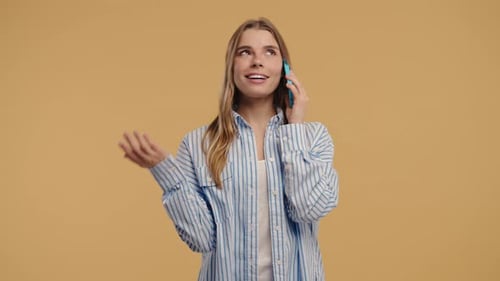 Woman Talking on Phone in Studio Setting