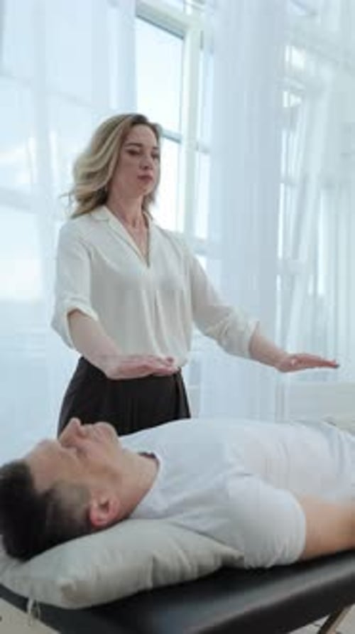 Reiki Therapist Performing Spiritual Healing Session
