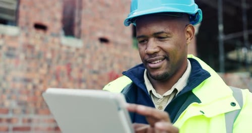 Black man, typing or tablet on construction site for planning, building project