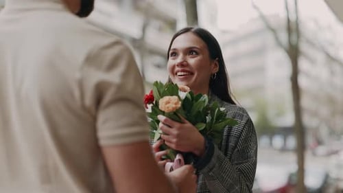 Woman Receives Flowers and Gift in City