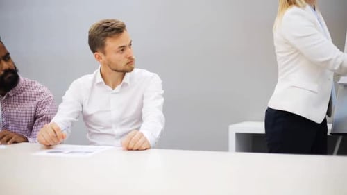 Diverse business team collaborating on a strategy presentation in the office