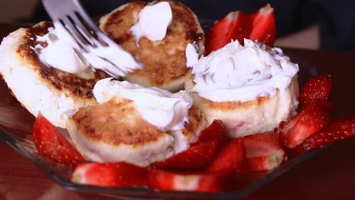 Fork Adds Cream to Cheesecakes with Strawberries