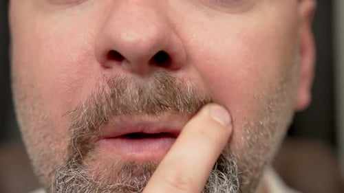 Man Running Finger Through Hair Beard and Moustache on Face Close Up Male Stroking Mustache and