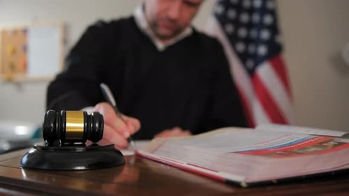 Judge's Hand with Wooden Judge Gavel Focus on Judge Gavel Slow Motion Close Up Footage