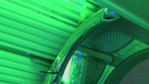 tilting down on a green tanning booth door