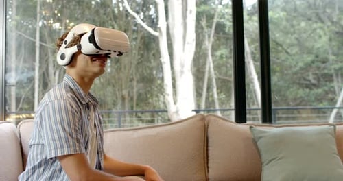 Young Adult Immersed in Virtual Reality at Home