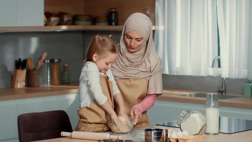Woman and Child Baking Together in Home Kitchen