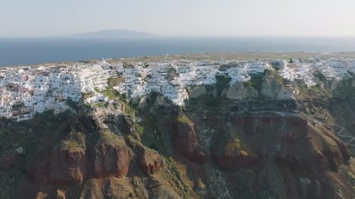 Aerial of buildings perched on Oia cliff, Santorini island, Greece