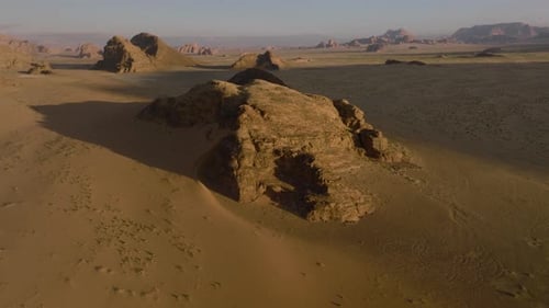 Daylight Over Red Sand Dune And Sandstone Mountains In Wadi Rum Desert In Jordan. Aerial Wide Shot