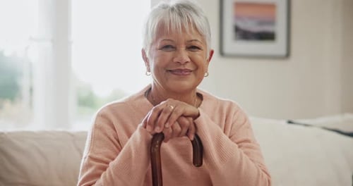 Senior Woman Smiling with Cane at Home