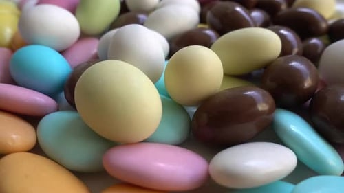 A set of almonds or colored pine nut almonds. Easter season.