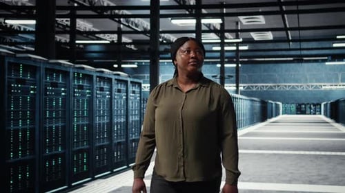 Portrait of Cheerful Data Center Engineer Conducting Security Audits