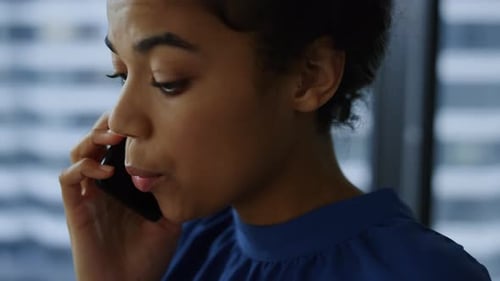 Positive Business Woman Calling Phone in Office. Black Businesswoman Speaking Smartphone. Corporate