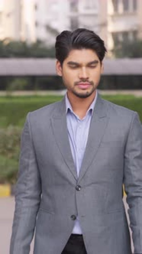 Vertical Video of Sad Indian Businessman Walking