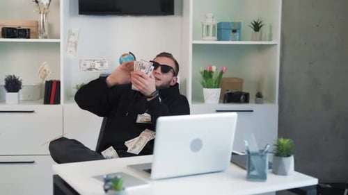 Young Adult Rejoices, Throwing Money in the Air