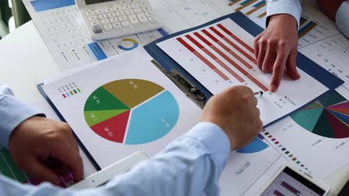 Businessman Analyzing Financial Investment Data Graph