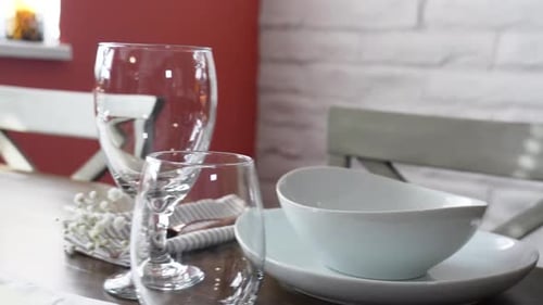 Elegant Dining Table Setting with Flowers and Candles