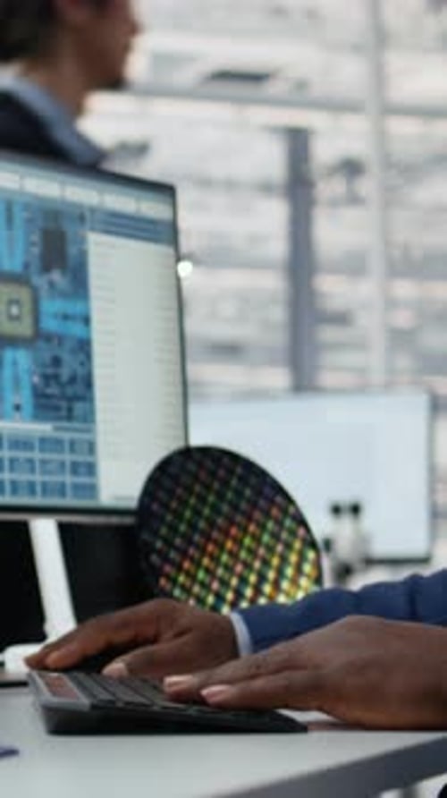 Vertical Video Close Up of Technician in Semiconductors Factory Office Analyzing PCBs