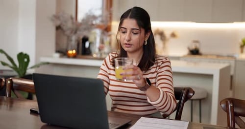 Woman Working From Home Drinking Juice