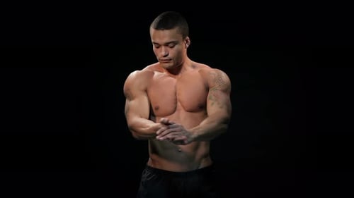 Low Key Strong Man Stretches His Wrists