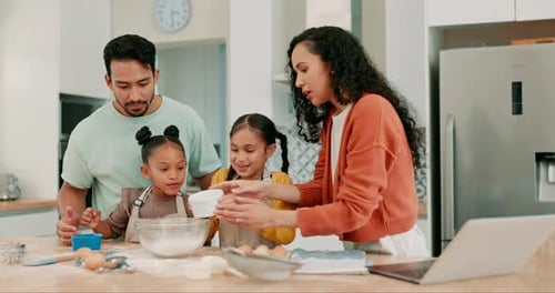 Family Baking Together in Bright Kitchen