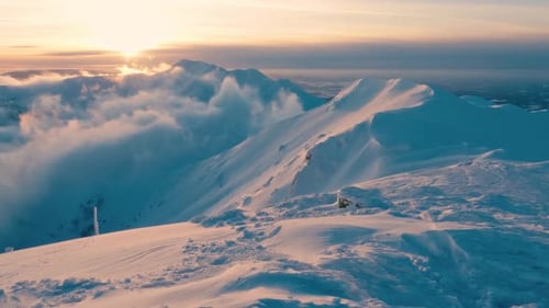 Reveal of Frozen Winter Mountains in Alps Nature at Magic Sunset Freedom Adventure Background 4K